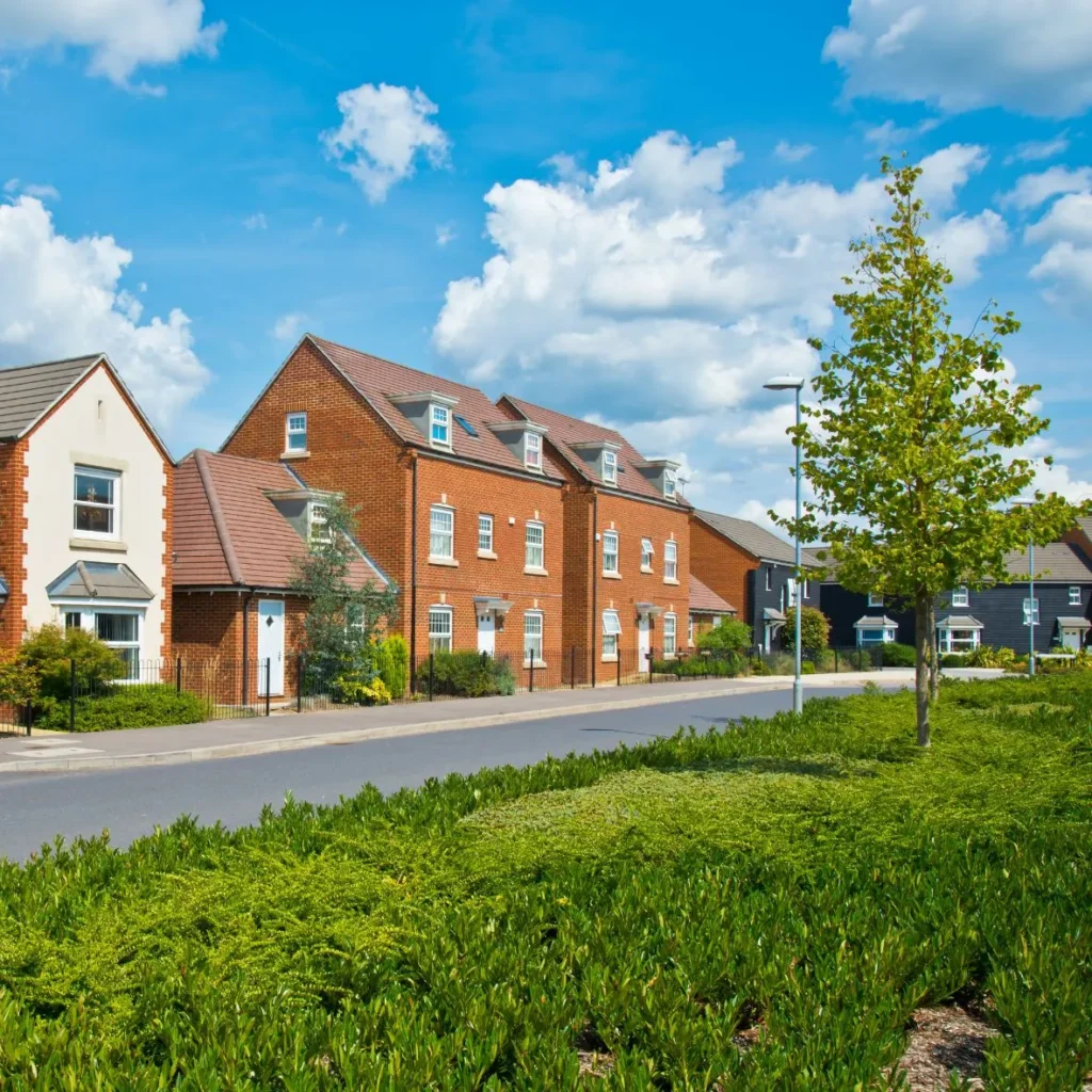 New houses with greenery surrounding them